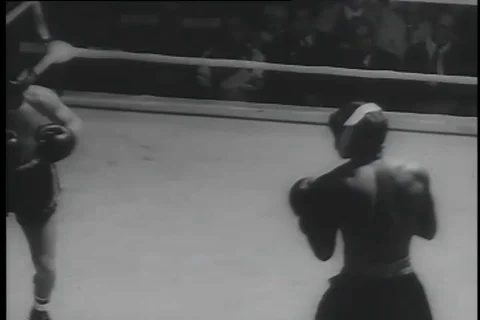 Boxer knocks down his opponent during the tournament - 1956 Stock Footage 99085778