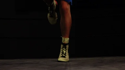 Boxer making rope jumps in the ring, close up feet moves slow motion Stock Footage 101214818