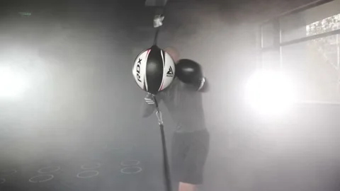 Boxer Man Hitting Speed Bag during Boxing Workout in the Gym (Slow Motion) Stock Footage 174927041