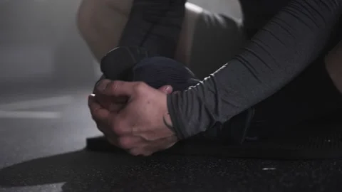 Boxer Man Stretching before a Boxing Workout in the Gym Stock Footage 174924700