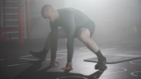 Boxer Man Stretching before a Boxing Workout in the Gym Stock Footage 174925351