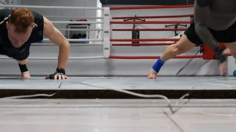 Boxer man training push ups exercises and clapping hands in gym. Fighters doing Stock Footage 111621464