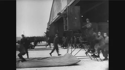 Boxer Max Schmeling trains to be a paratrooper and boxer Joe Louis trains on a Stock Footage 100554780