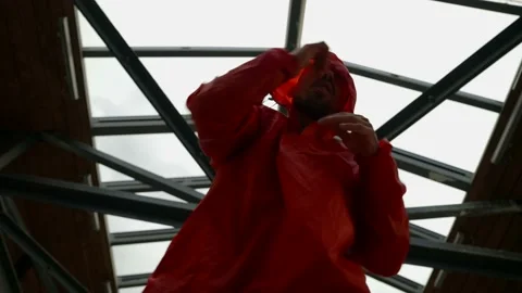 Boxer or fighter is training punches by hands, epic shot of man in red raincoat 스톡 동영상 163753260