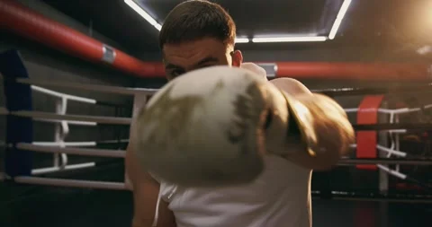 A boxer practices his punching technique on camera Stock Footage 275275921
