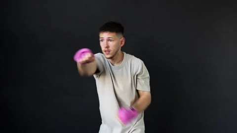 Boxer practices punches in training session in gym studio Stock Footage 312383734