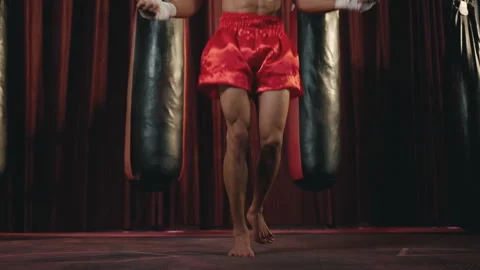 Boxer practicing jumping rope for footwork practice inside gym Stock Footage 247412771