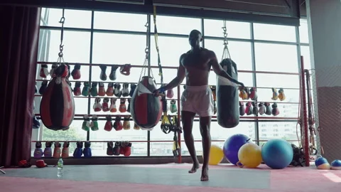 Boxer practicing jumping rope for footwork practice inside gym Vídeos de archivo 254804229