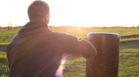 Boxer punching back rear view sunset Stock Footage 64221141