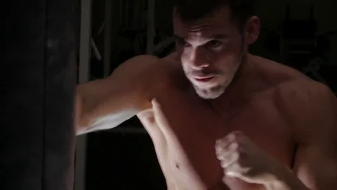 Boxer pushes punching pear Stock Footage 75807420