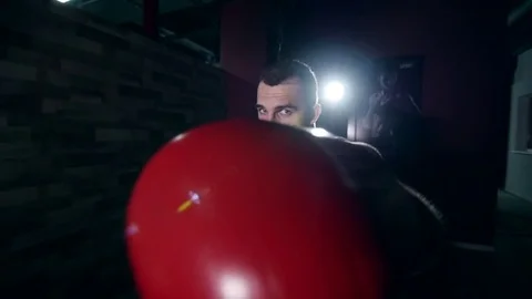 A boxer shadow boxes in the gym 動画素材 75905885