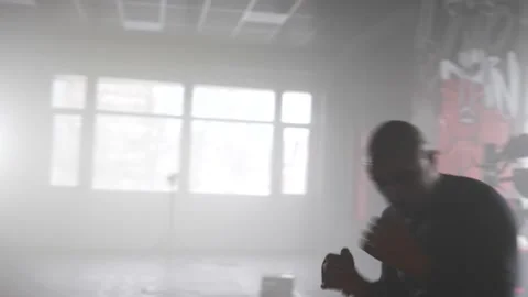 Boxer Shadowboxing Workout facing Camera with Yellow Boxing Wraps Stock Footage 174926050