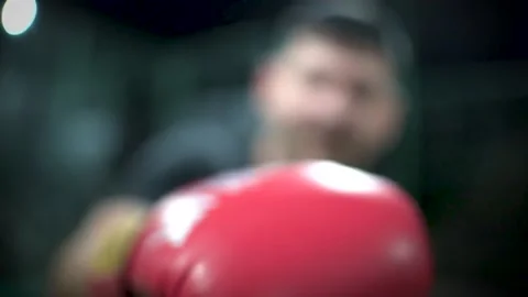 Boxer throwing jabs and punchs with boxing gloves at camera 動画素材 233911497