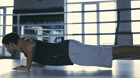 Boxer training. Doing push up exercises at the prize ring. Stock Footage 98587881