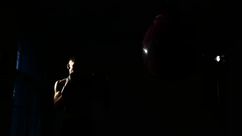 Boxer training in a gym, dramatic lighting Stock Footage 75784756