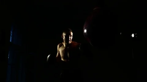 Boxer training in a gym, dramatic lighting Stock Footage 75784852