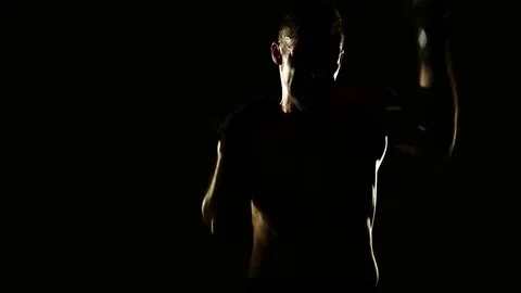 Boxer training in a gym, dramatic lighting Stock Footage 75785126