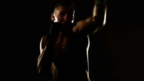 Boxer training in a gym, dramatic lighting Stock Footage 75785222