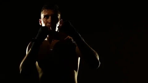 Boxer training in a gym, dramatic lighting Stock Footage 75785312