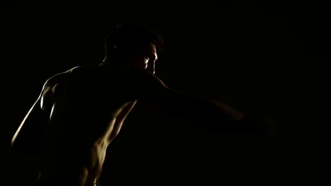 Boxer training in a gym, dramatic lighting Stock Footage 75785691