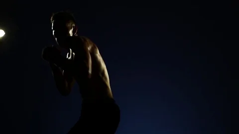 Boxer training in a gym, dramatic lighting Stock Footage 75785864