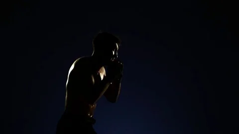 Boxer training in a gym, dramatic lighting Stock Footage 75785941