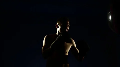 Boxer training in a gym, dramatic lighting Stock Footage 75786165