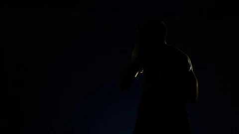 Boxer training in a gym, dramatic lighting Stock Footage 75797479