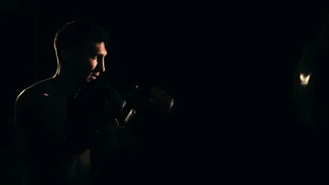 Boxer training in a gym, dramatic lighting Stock Footage 75812830