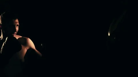 Boxer training in a gym, dramatic lighting Stock Footage 75812865