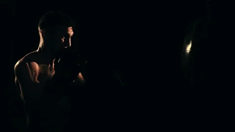 Boxer training in a gym, dramatic lighting Stock Footage 75812886