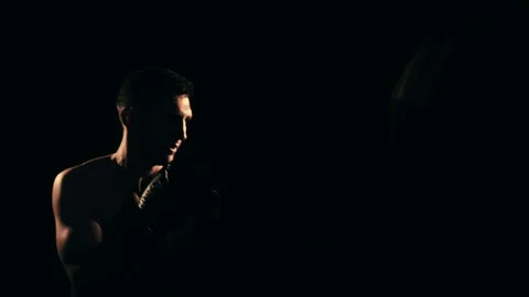 Boxer training in a gym, dramatic lighting Stock Footage 75812897
