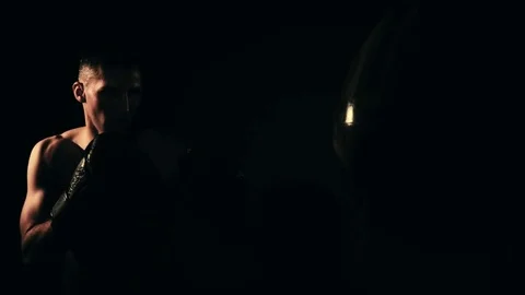 Boxer training in a gym, dramatic lighting Stock Footage 75812907