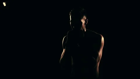 Boxer training in a gym, dramatic lighting Stock Footage 75813094