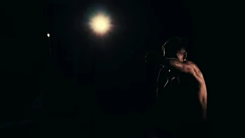 Boxer training in a gym, dramatic lighting Stock Footage 75813118