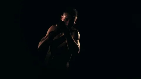 Boxer training in a gym, dramatic lighting Stock Footage 75813150