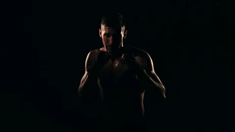 Boxer training in a gym, dramatic lighting Stock Footage 75813169