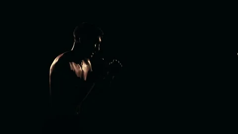 Boxer training in a gym, dramatic lighting Stock Footage 75813194