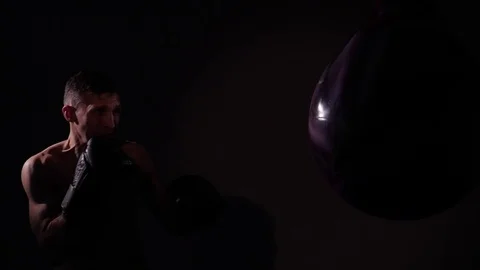 Boxer training in a gym, dramatic lighting Stock Footage 75826094