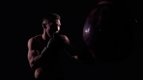 Boxer training in a gym, dramatic lighting Stock Footage 75826260
