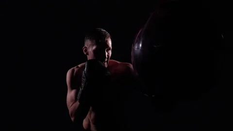 Boxer training in a gym, dramatic lighting Stock Footage 75826393