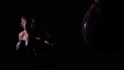 Boxer training in a gym, dramatic lighting Stock Footage 75826517