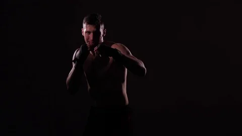 Boxer training in a gym, dramatic lighting Stock Footage 75826761