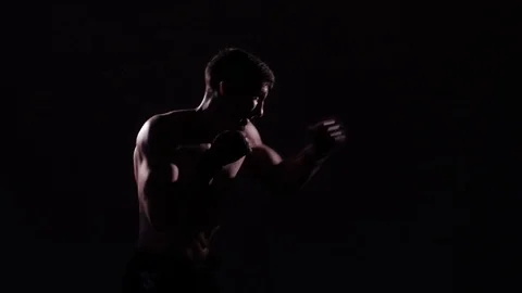 Boxer training in a gym, dramatic lighting Stock Footage 75826829