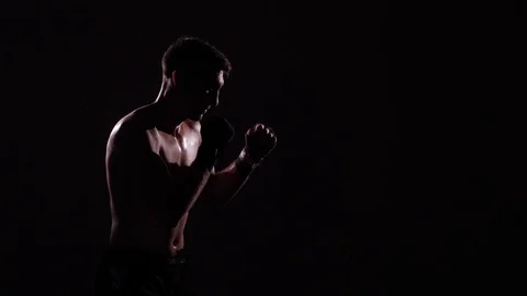 Boxer training in a gym, dramatic lighting Stock Footage 75826953