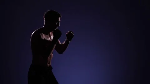 Boxer training in a gym, dramatic lighting Stock Footage 75827207