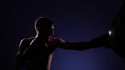 Boxer training in a gym, dramatic lighting Stock Footage 75827349