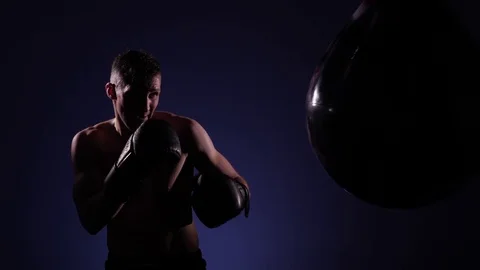 Boxer training in a gym, dramatic lighting Stock Footage 75827481