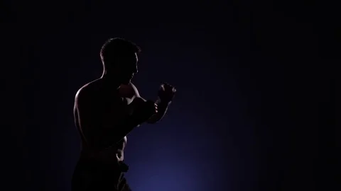 Boxer training in a gym, dramatic lighting Stock Footage 75827565