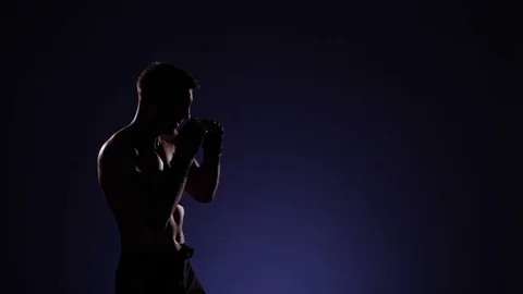 Boxer training in a gym, dramatic lighting Stock Footage 75827640